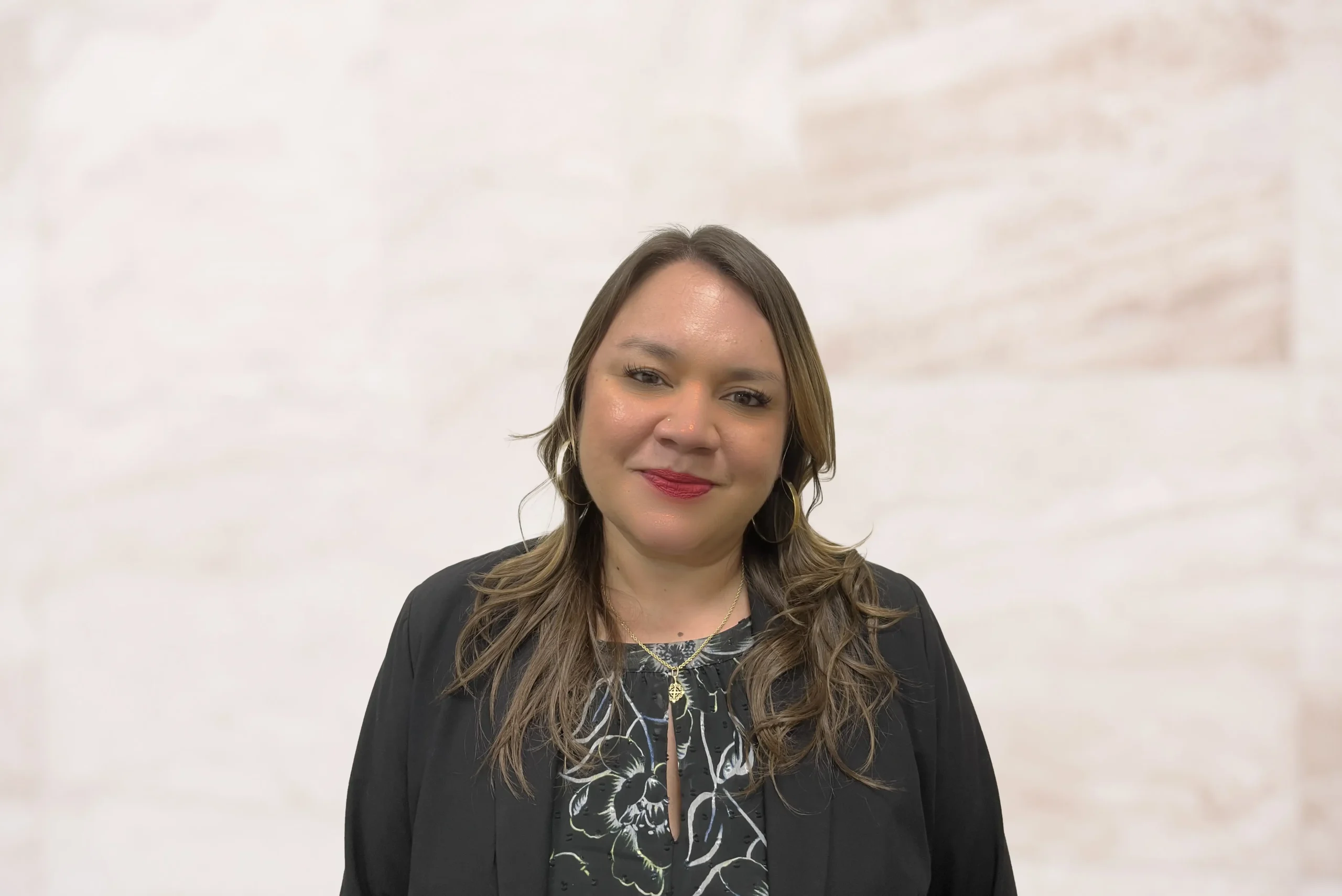 Catherine Estrada, Associate Attorney at Law Office of Bryan Fagan, smiling in professional attire, emphasizing her expertise in family law and advocacy for families and children.