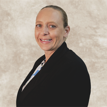 Haley Knighten, attorney specializing in family and criminal law, smiling in professional attire against a neutral background, reflecting her commitment to providing compassionate legal guidance.