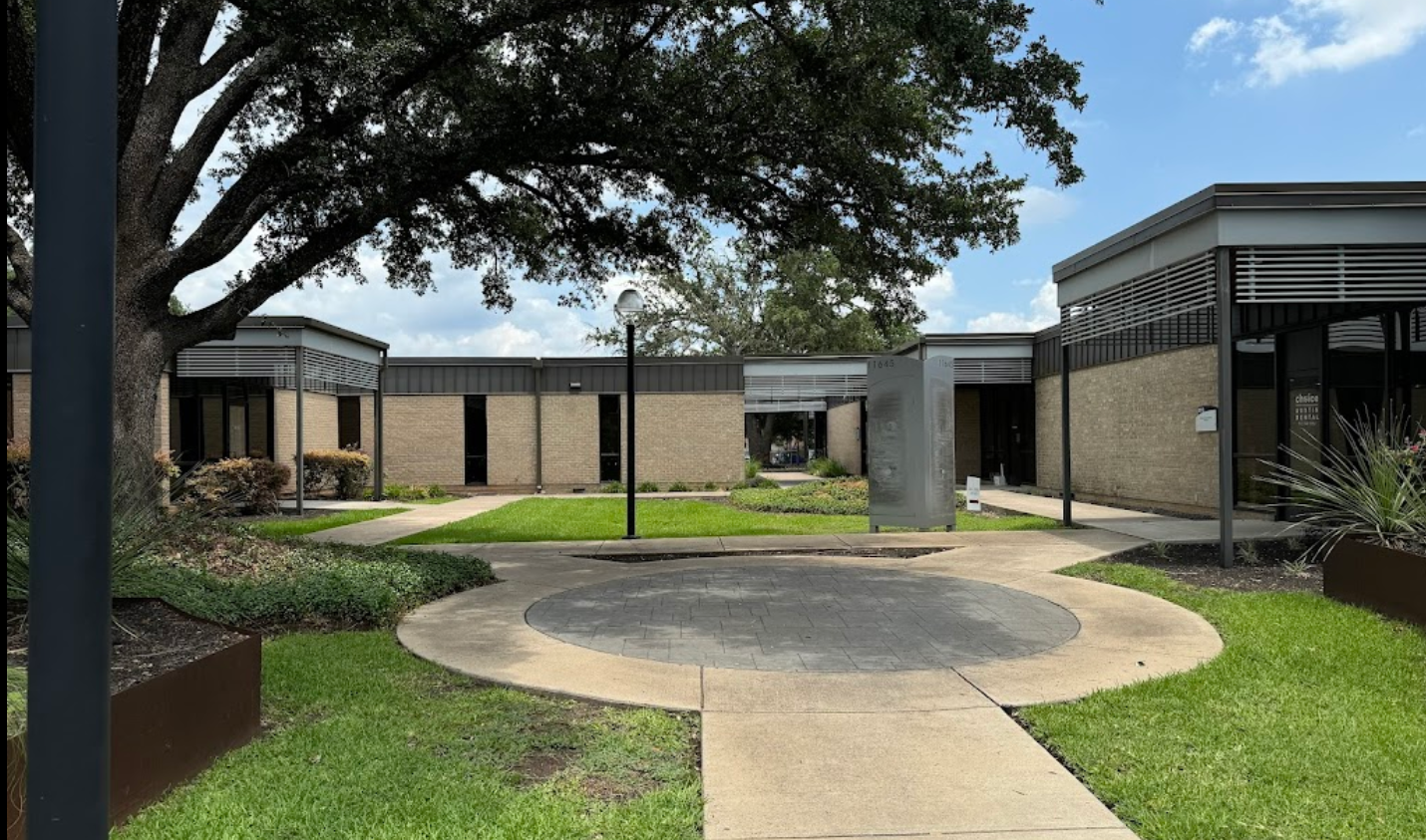 Austin office building of Bryan Fagan Law Office, featuring landscaped grounds, walkways, and modern architecture, located in Austin, TX.