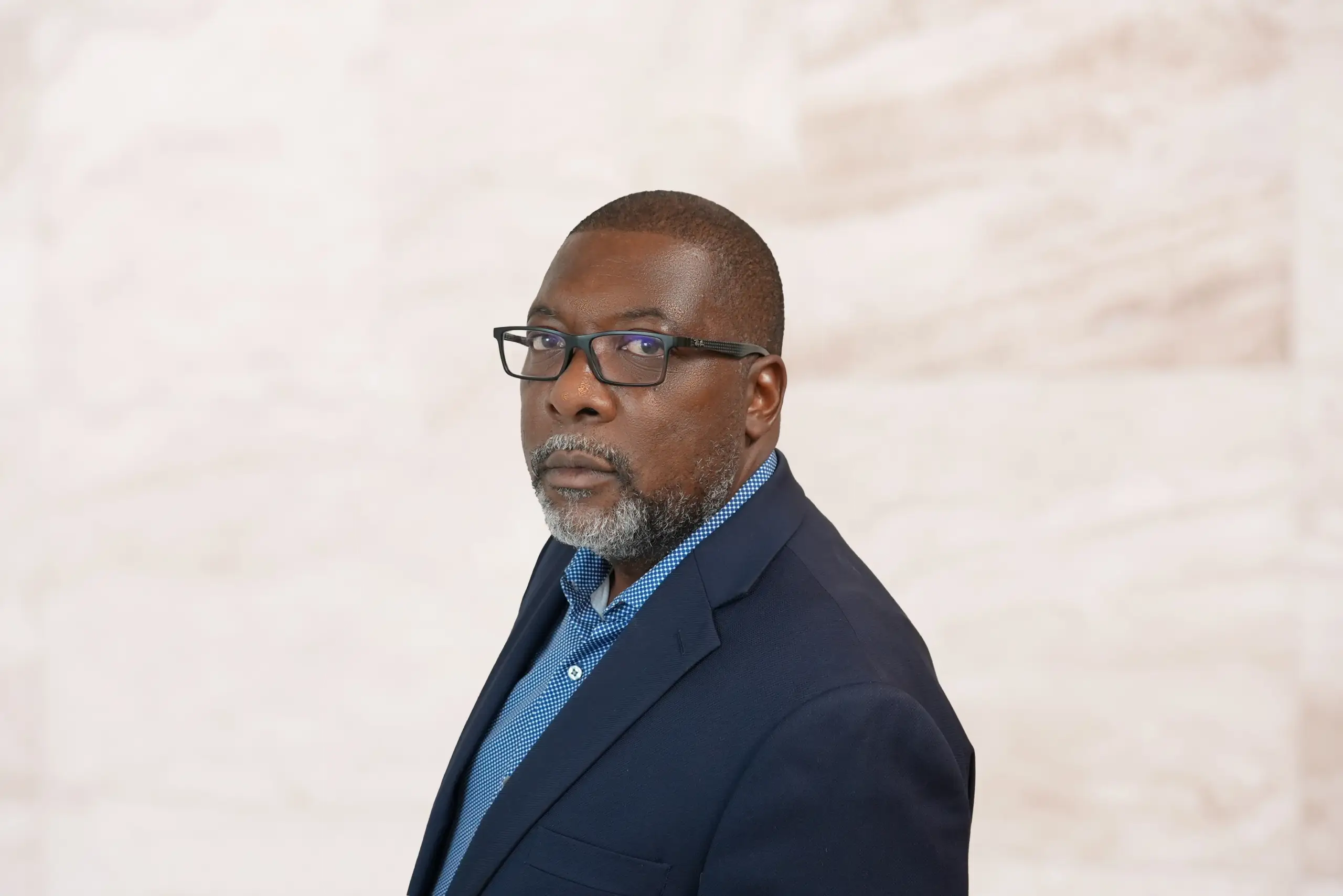 Lawrence Eulette, attorney at Bryan Fagan, PLLC, in a professional suit, looking confidently at the camera against a neutral background.